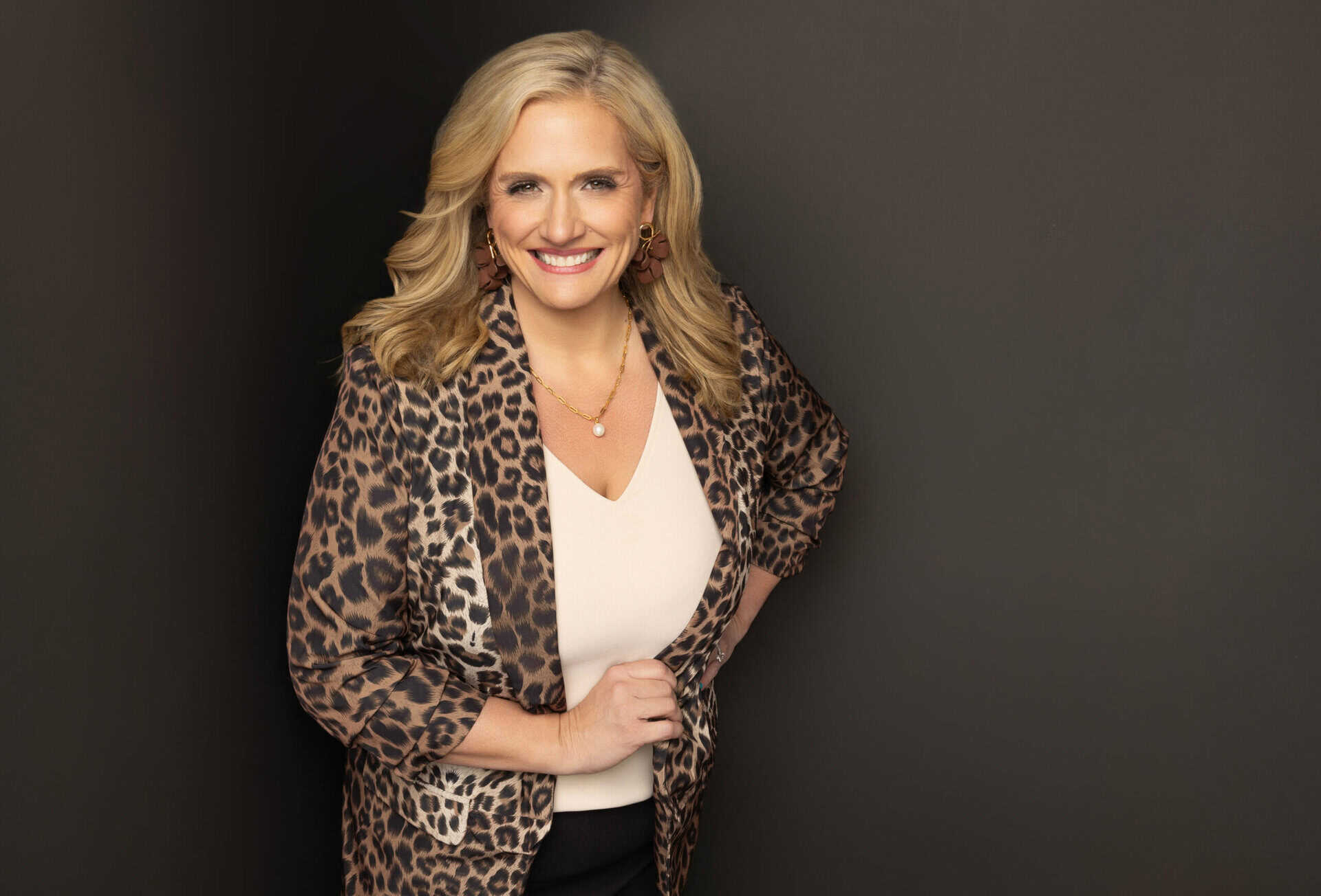 Estelle Winsett wearing a leopard print blazer, personal stylist helping women attorneys discover their signature style