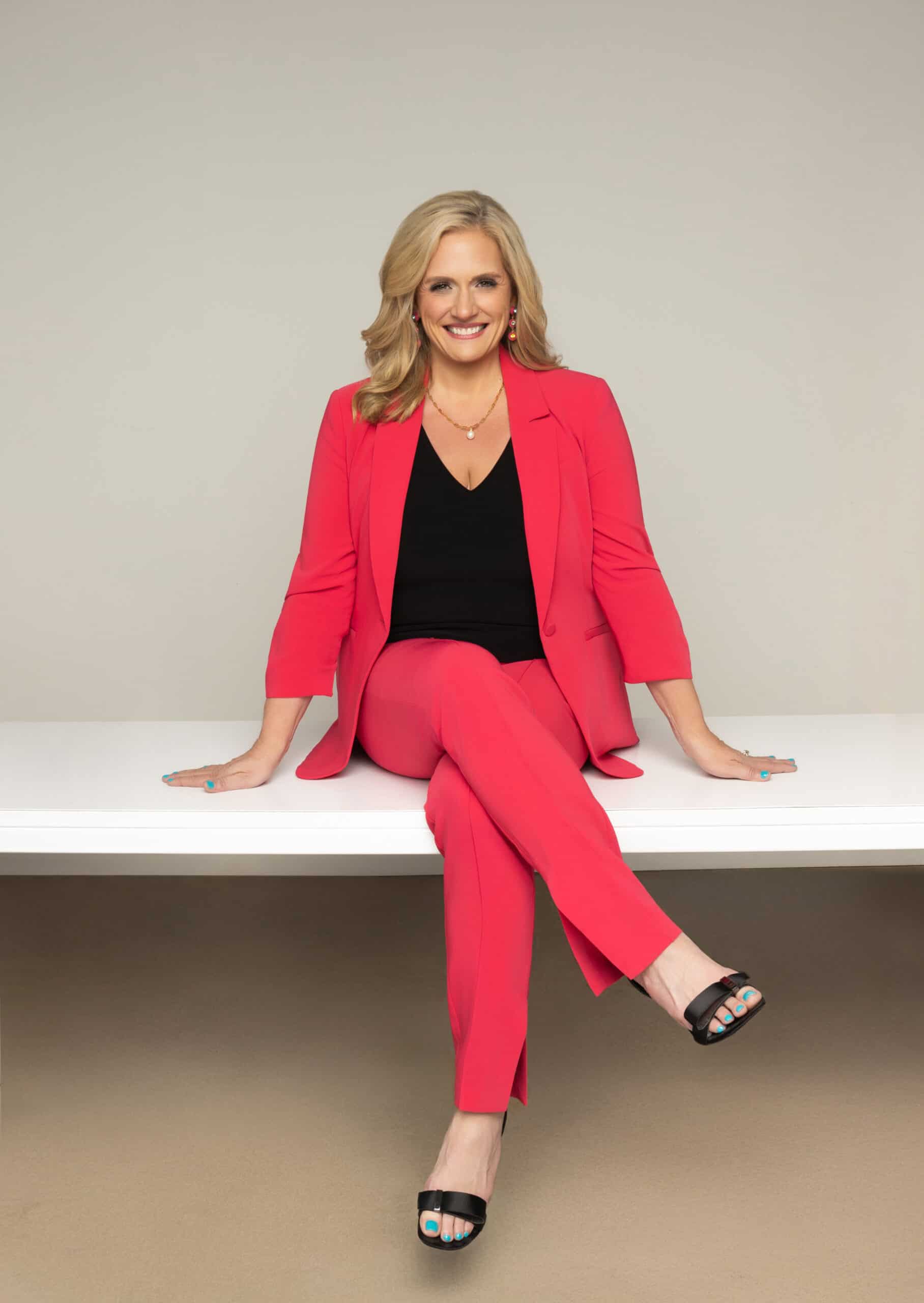 Estelle Winsett, personal stylist for women attorneys, in a red pantsuit